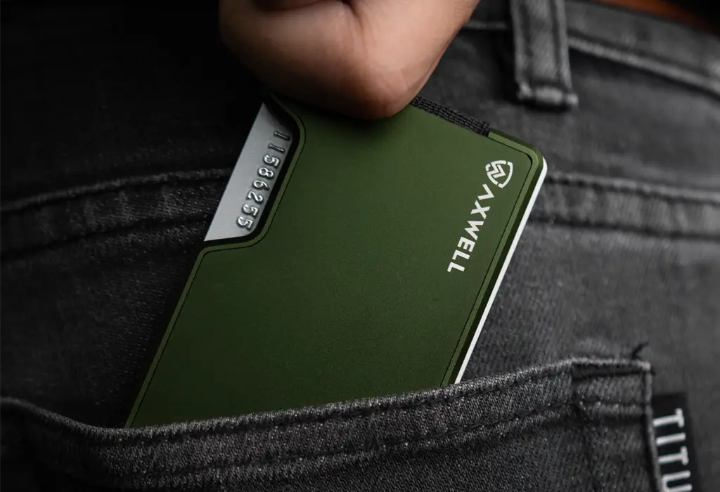 Axwell olive aluminum wallet in a jeans front pocket