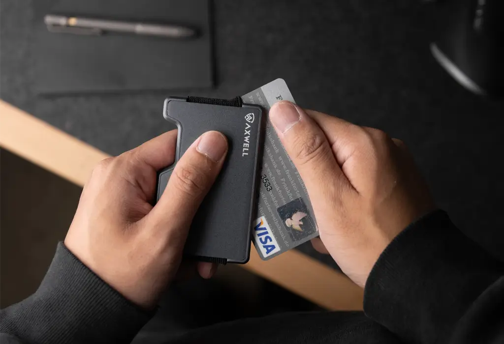 Loading a credit card into a gunmetal Axwell wallet