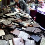 Article: How To Spot a Fake COACH Wallet or Bag Image: wallets in counterfeiting store