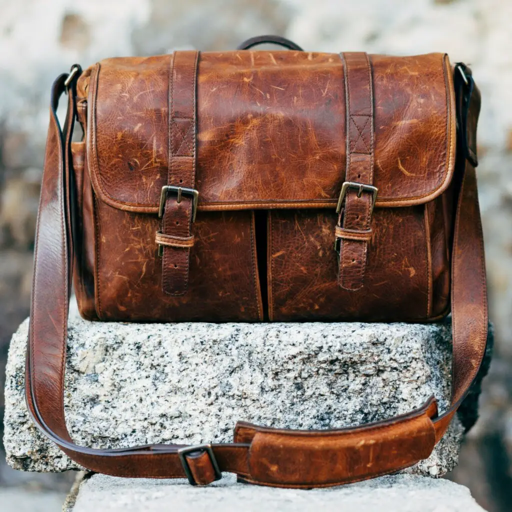 Aged leather Messenger Bag On Wall