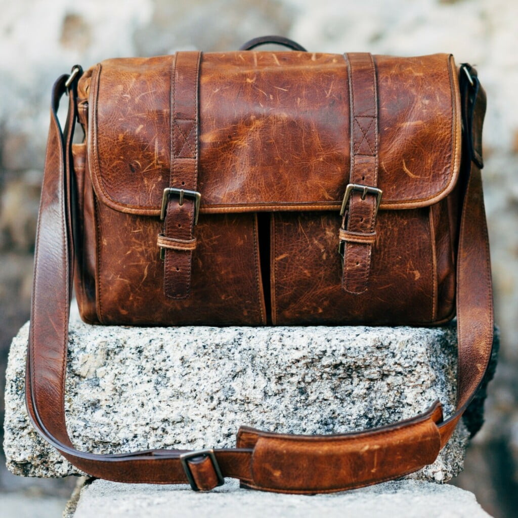 Aged leather Messenger Bag On Wall