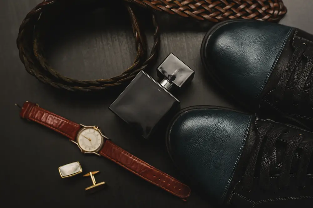 men's accessories on brown wooden table