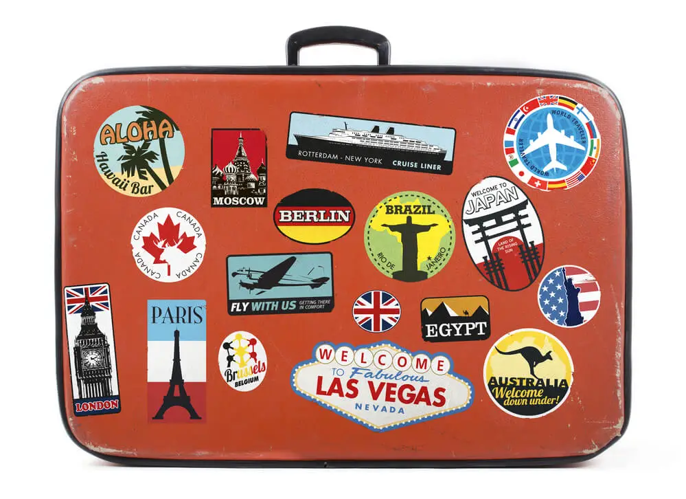 Old Suitcase with many travel stickers