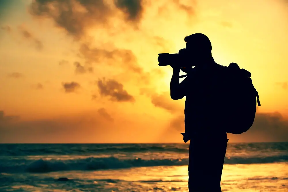 Silhouette of Photographer with backpack