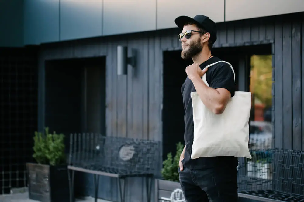 man with tote bag